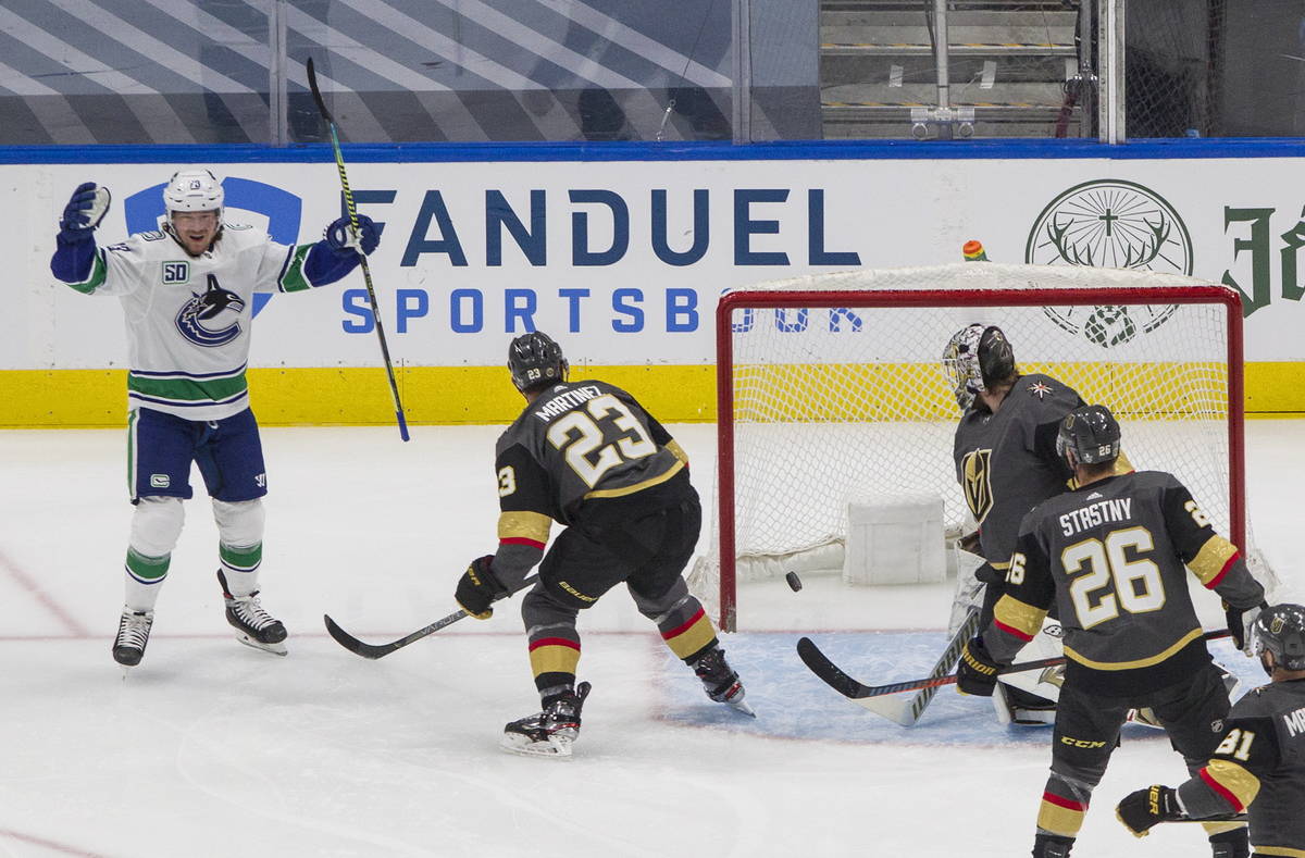 Vegas Golden Knights' goalie Robin Lehner (90) is scored on by Vancouver Canucks' Tyler Toffoli ...