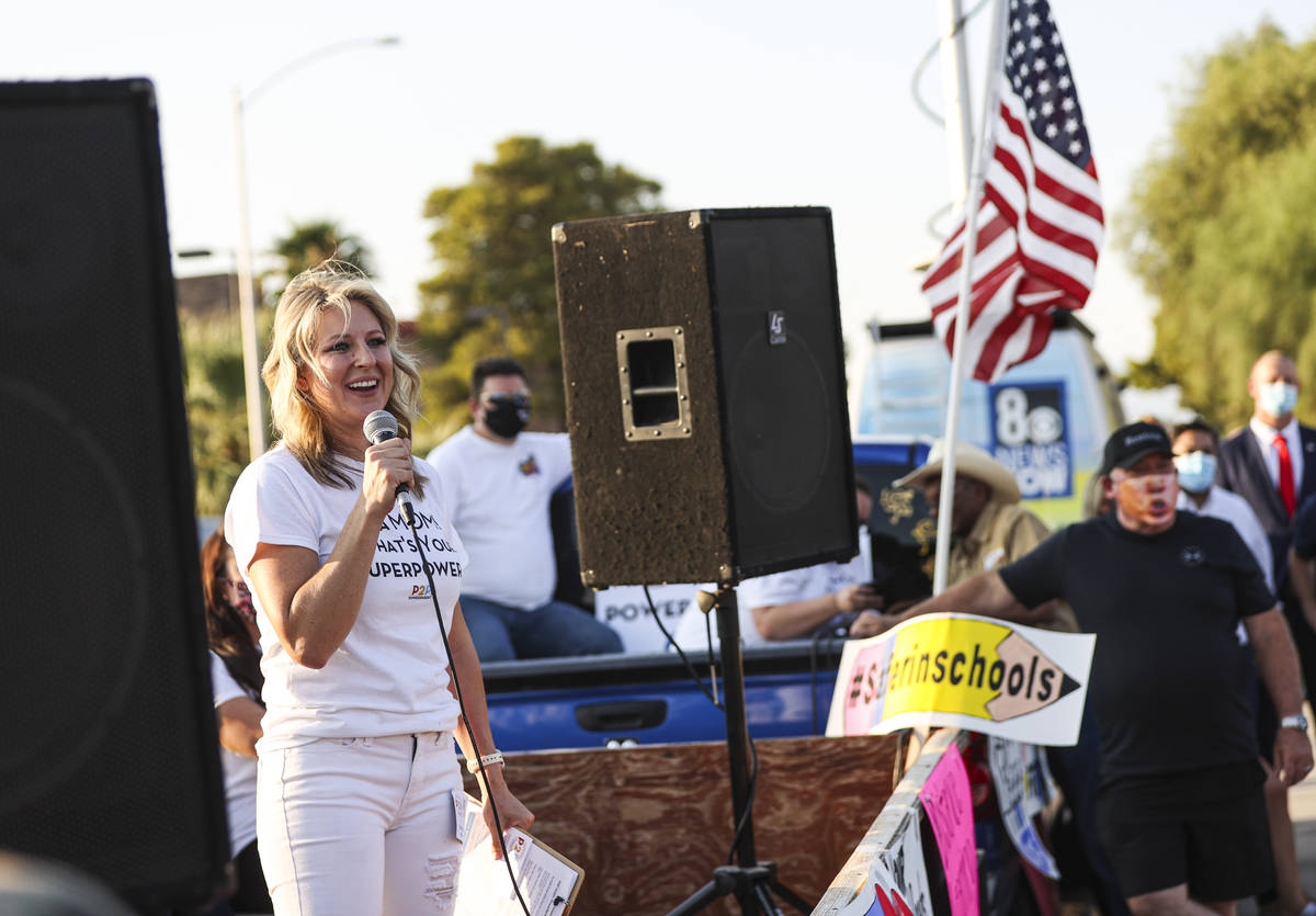 Erin Phillips, president of Power2Parent, speaks during a demonstration in support of reopening ...
