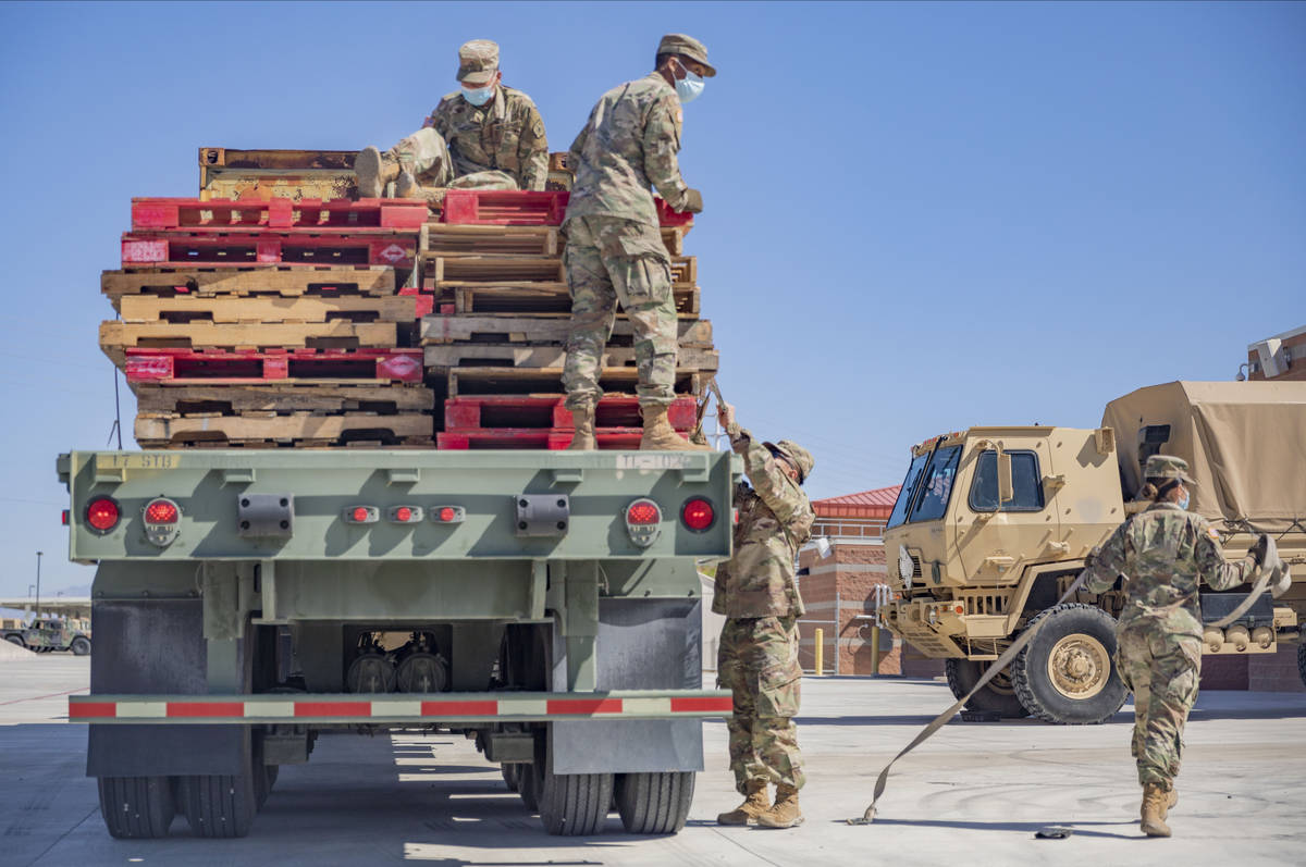 Nevada National Guardsmen recover pallets used to deliver personal protective equipment to nurs ...