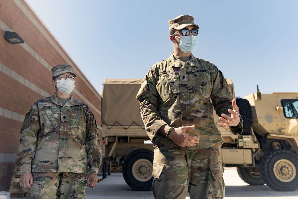 Specialist Iris Ramirez, left, and Specialist Karim Arafa discuss the mission of delivering per ...