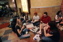 RJ FILE*** JASON BEAN/LAS VEGAS REVIEW-JOURNAL A group of friends share cupcakes and card gam ...
