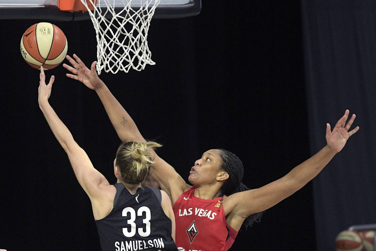 Dallas Wings guard Katie Lou Samuelson (33) goes up for a shot in front of Las Vegas Aces cente ...