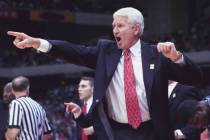 Arizona coach Lute Olson directs his team from the sidelines during the first half of the NCAA ...