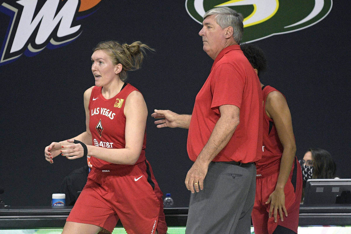 Las Vegas Aces head coach Bill Laimbeer sends center Carolyn Swords, left, into the game during ...
