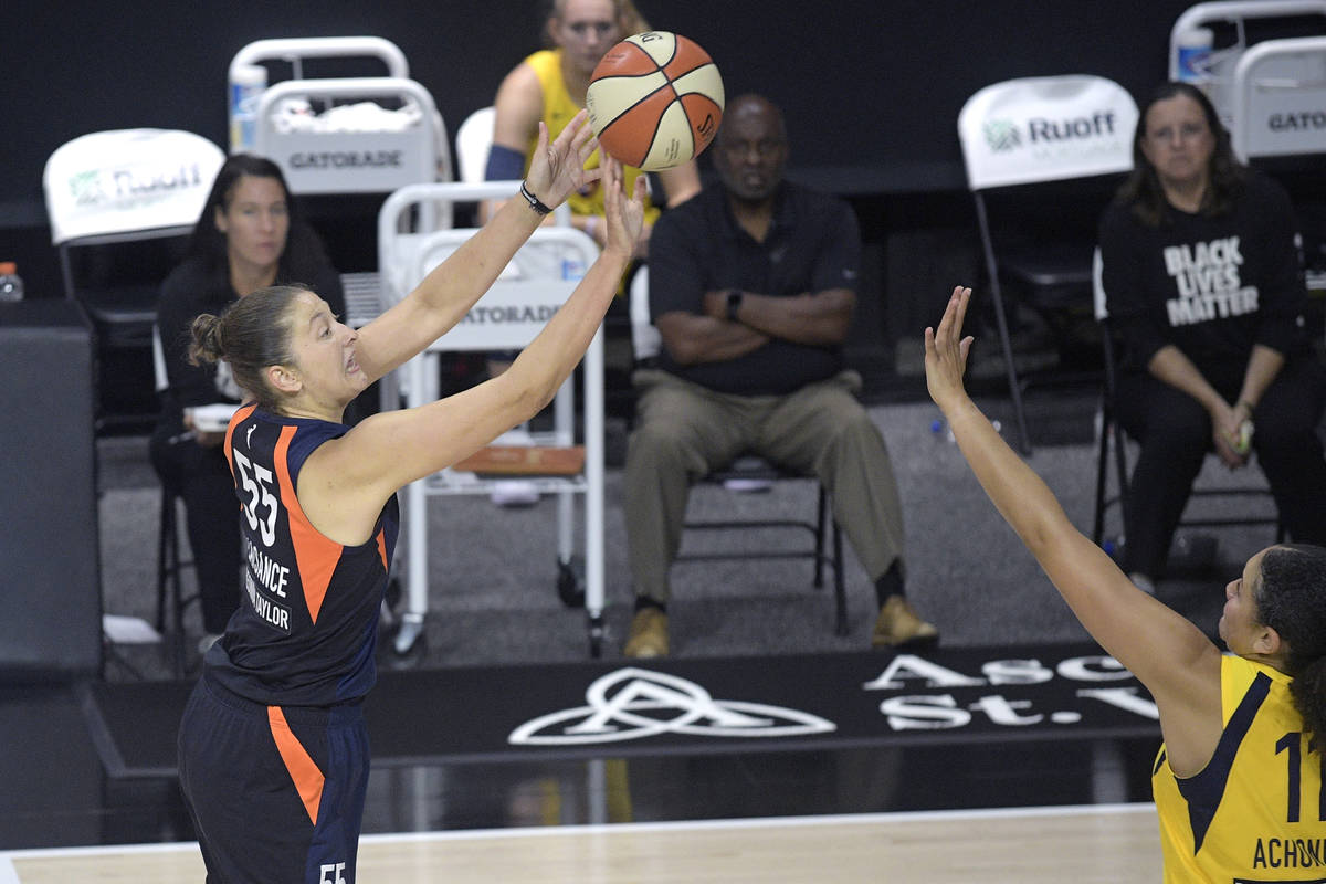 Connecticut Sun forward Theresa Plaisance (55) attempts a shot in front of Indiana Fever center ...