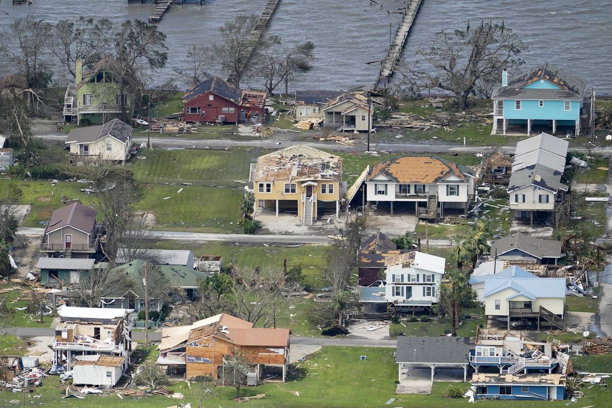 Buildings and homes are damaged in the aftermath of Hurricane Laura Thursday, Aug. 27, 2020, ne ...