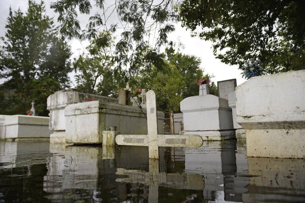A cemetery along Privateer Blvd. in Barataria, La. is inundated in water as water levels surge ...