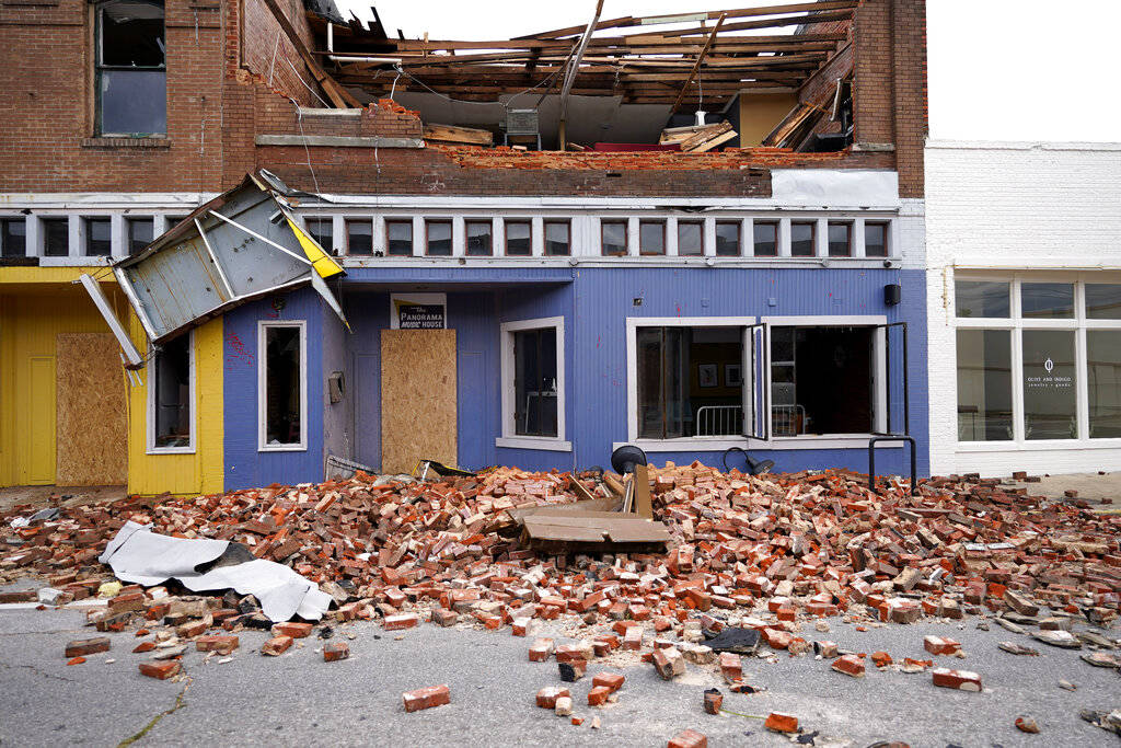 Debris is seen near a business on Thursday, Aug. 27, 2020, in Lake Charles, La., in the afterma ...