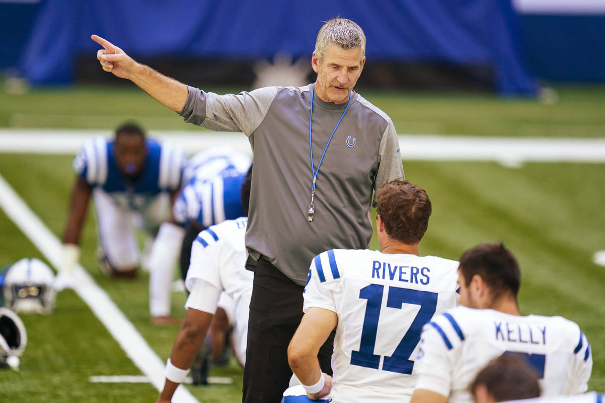 Indianapolis Colts head coach Frank Reich talks with quarterback Philip Rivers (17) during prac ...