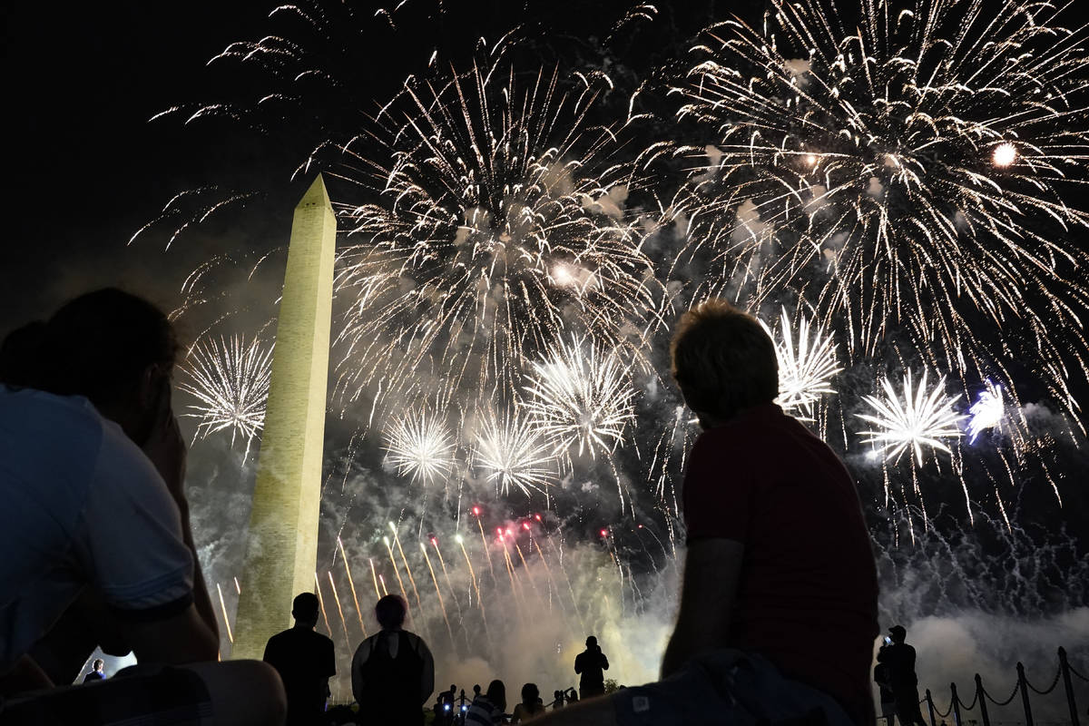 Fireworks light up the sky around the Washington Monument after President Donald Trump delivere ...