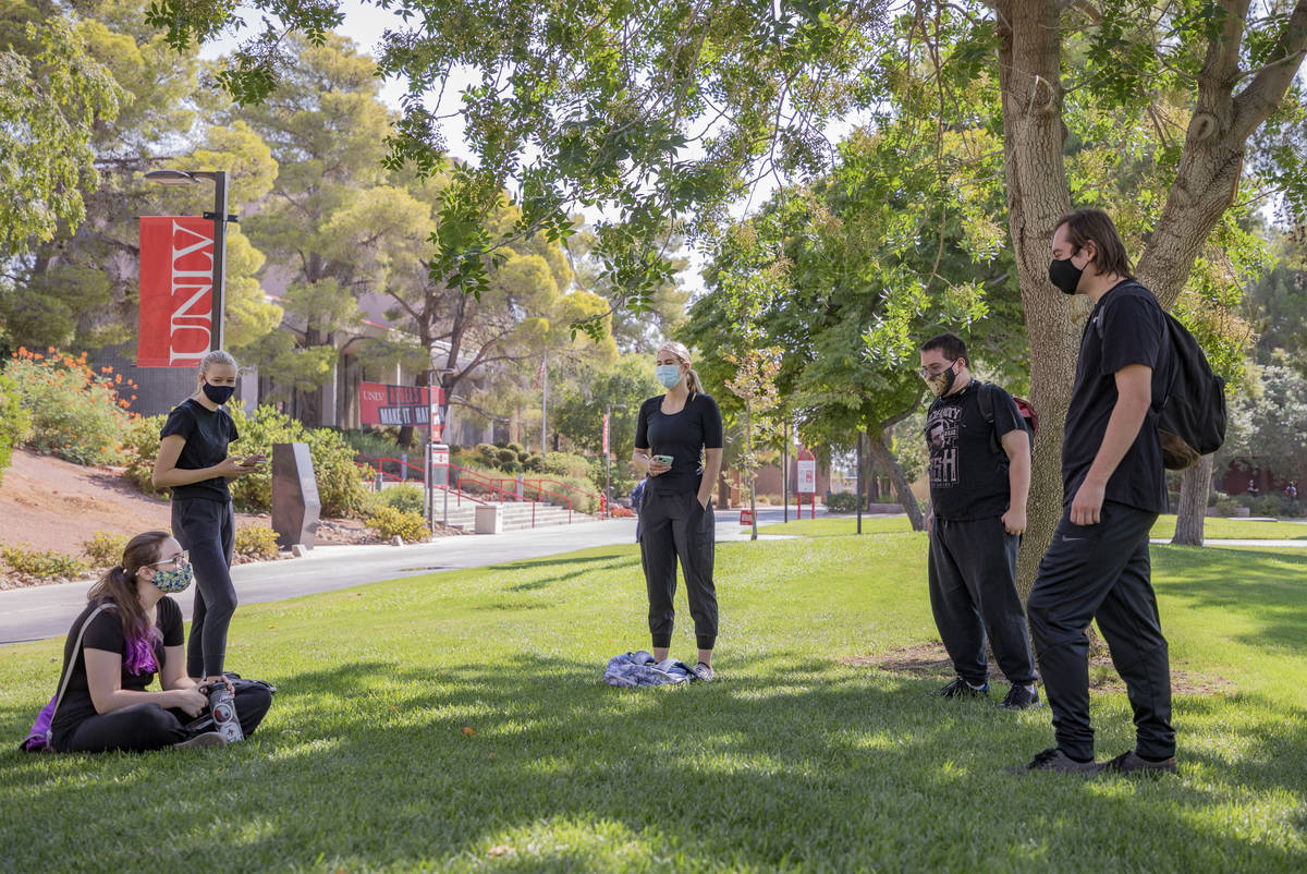 Students taking Sound and Movement are seen social distancing before class begins outside of Ar ...