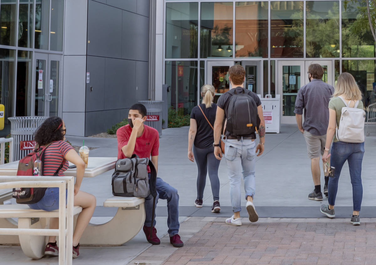 Students are seen outside of the Student Union at UNLV in Las Vegas on Thursday morning, Aug. 2 ...