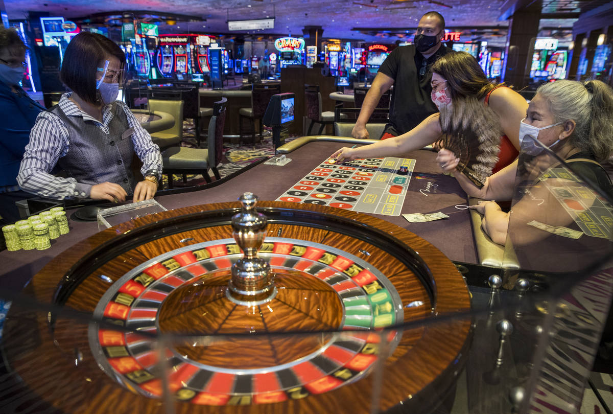 (From left) Roulette croupier Umee Mercado looks on as players Ted, Stepheni and Estrella Steel ...