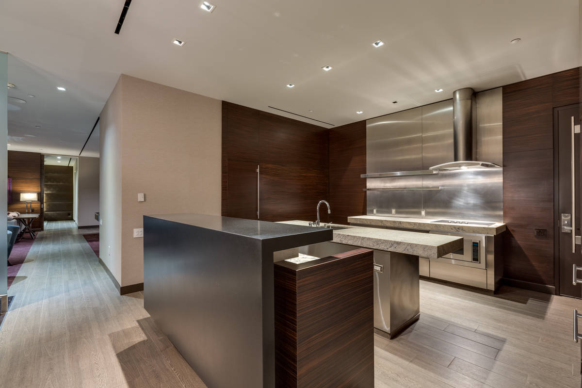 The kitchen features double islands with upgraded granite counters. (Luxury Estates International)