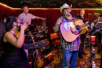 Owner Bobby Kingston, right, says a toast as he plays with his band on the final night before S ...