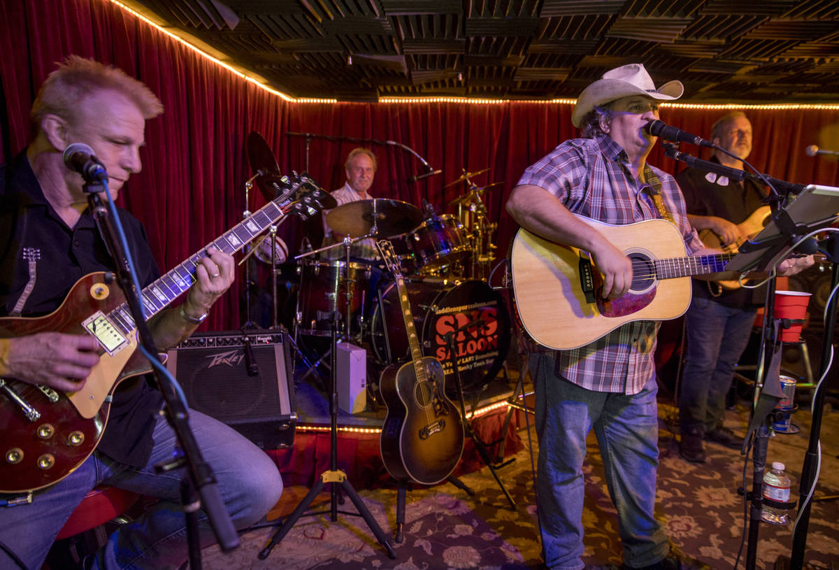Owner Bobby Kingston, right, sings and plays with his band on the final night before Saddle N S ...