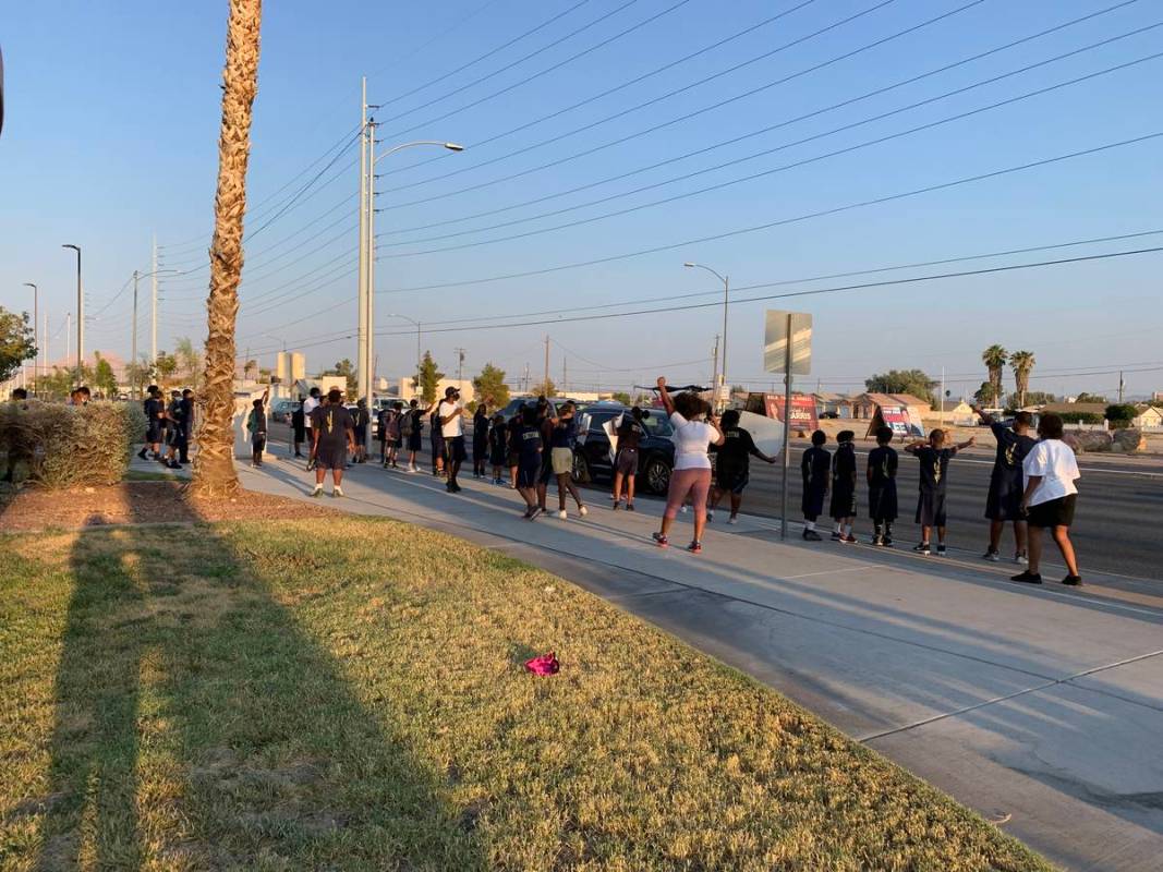 Dozens of children gathered for a peaceful protest against racism and police brutality outside ...