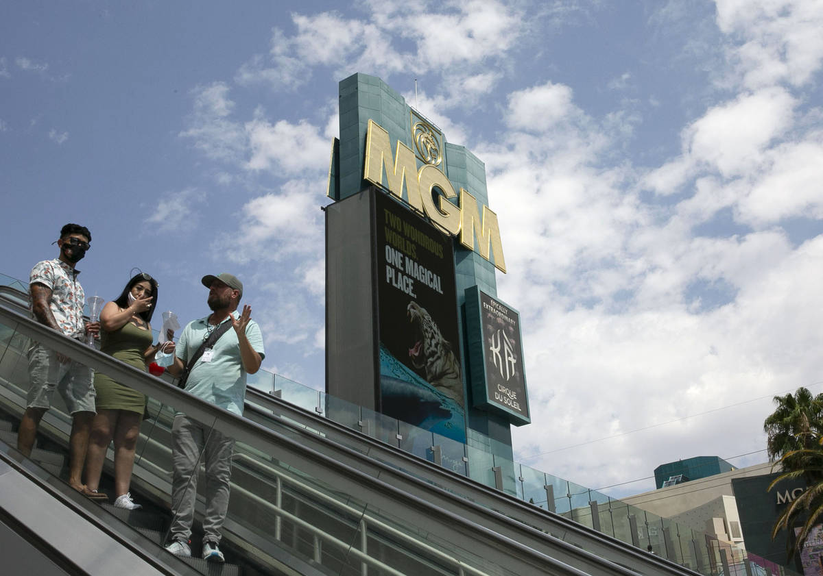 Pedestrians use the escalator near a pedestrian bridge linking New York-New York and MGM Grand ...