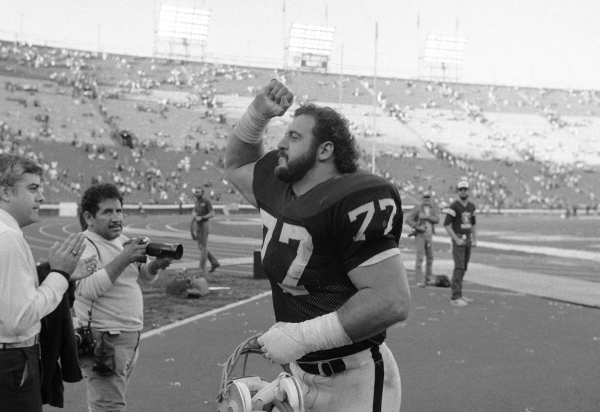 In this Jan. 2, 1984, file photo, Los Angeles Raiders Lyle Alzado gives a fist of victory after ...