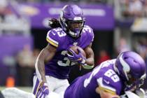 Minnesota Vikings running back Dalvin Cook (33) runs with the football during the first half on ...