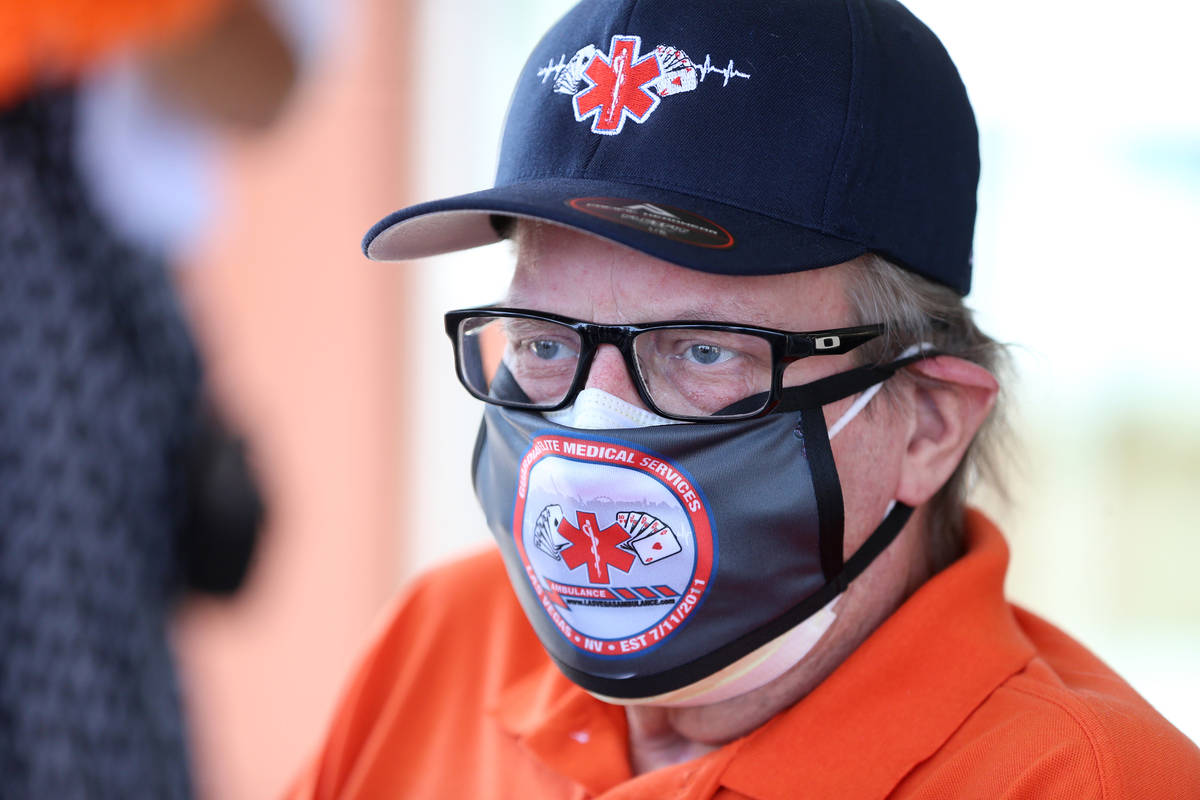 Paramedic John Foster, center, a recovered COVID-19 patient, is interviewed during his release ...