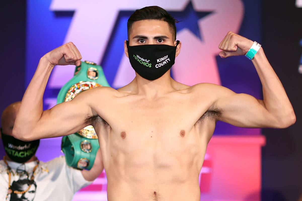 Jose Ramirez faces off with Viktor Postol on Friday during the weigh-in for their WBO and WBC j ...