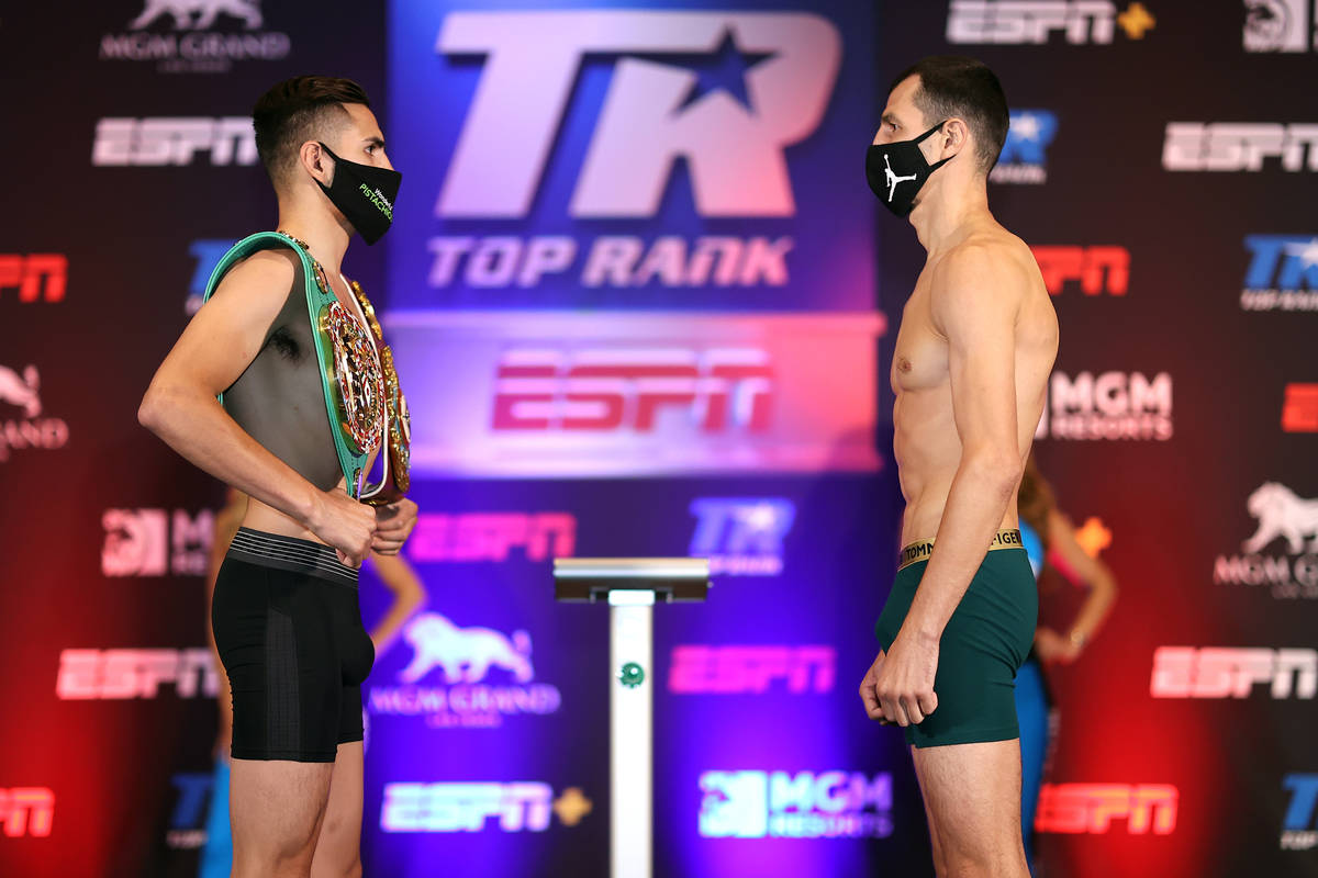 Jose Ramirez faces off with Viktor Postol on Friday during the weigh-in for their WBO and WBC j ...