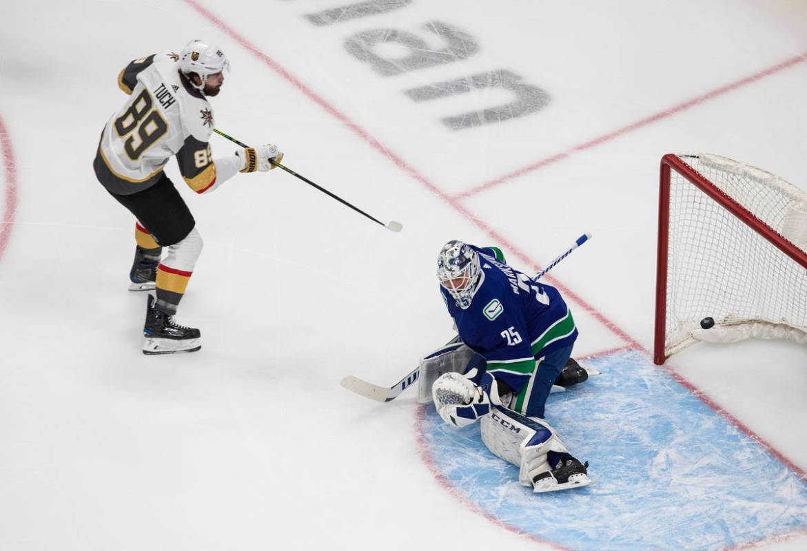 Vegas Golden Knights right wing Alex Tuch (89) scores on Vancouver Canucks goaltender Jacob Mar ...