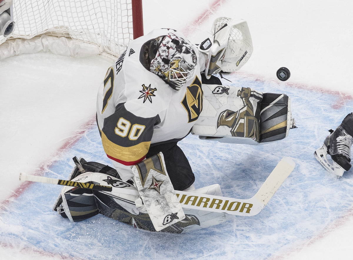 Vegas Golden Knights goalie Robin Lehner makes a save against the Vancouver Canucks during the ...