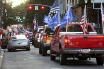 A caravan of supporters of President Donald Trump drive in downtown Portland, Ore., Saturday, A ...