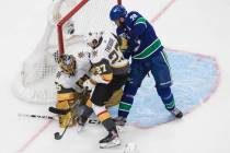 Vegas Golden Knights goalie Marc-Andre Fleury (29) makes a save on Vancouver Canucks' Brandon S ...