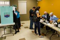 People check in to cast their votes at a polling station at Stupak Community Center in Las Vega ...