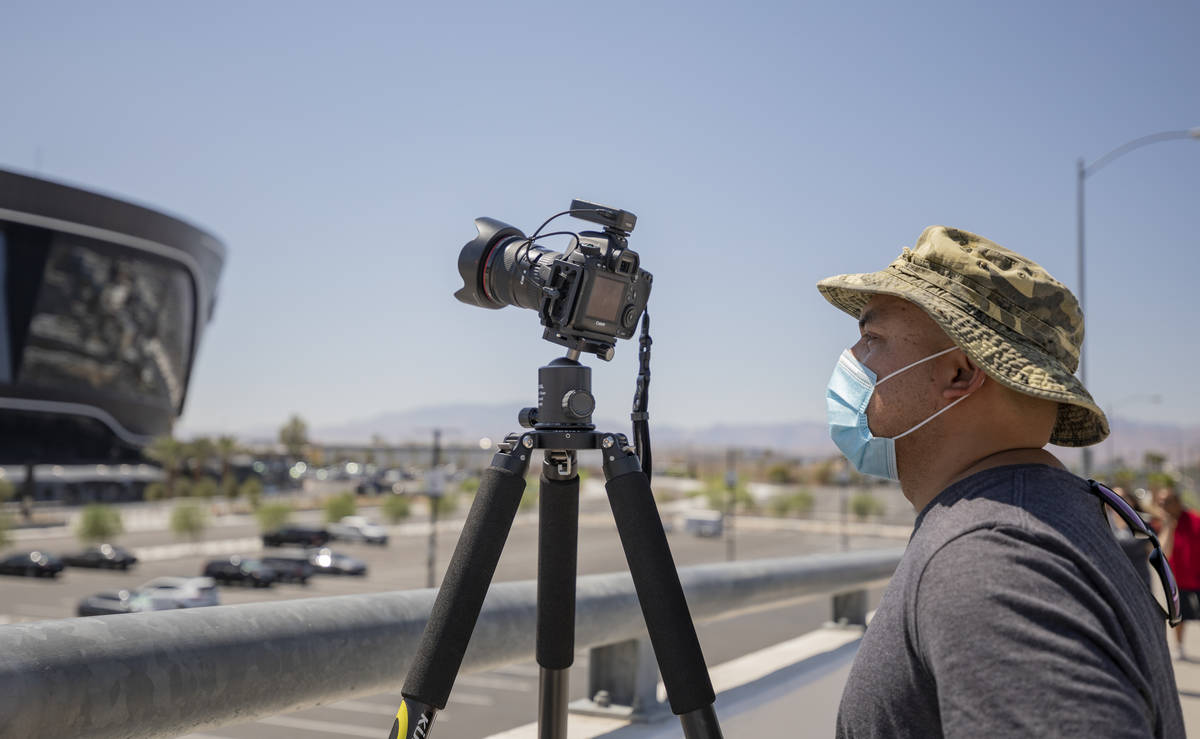 Glenn Guinita of Las Vegas waits to photograph the U.S. Air Force Thunderbirds fly over the All ...