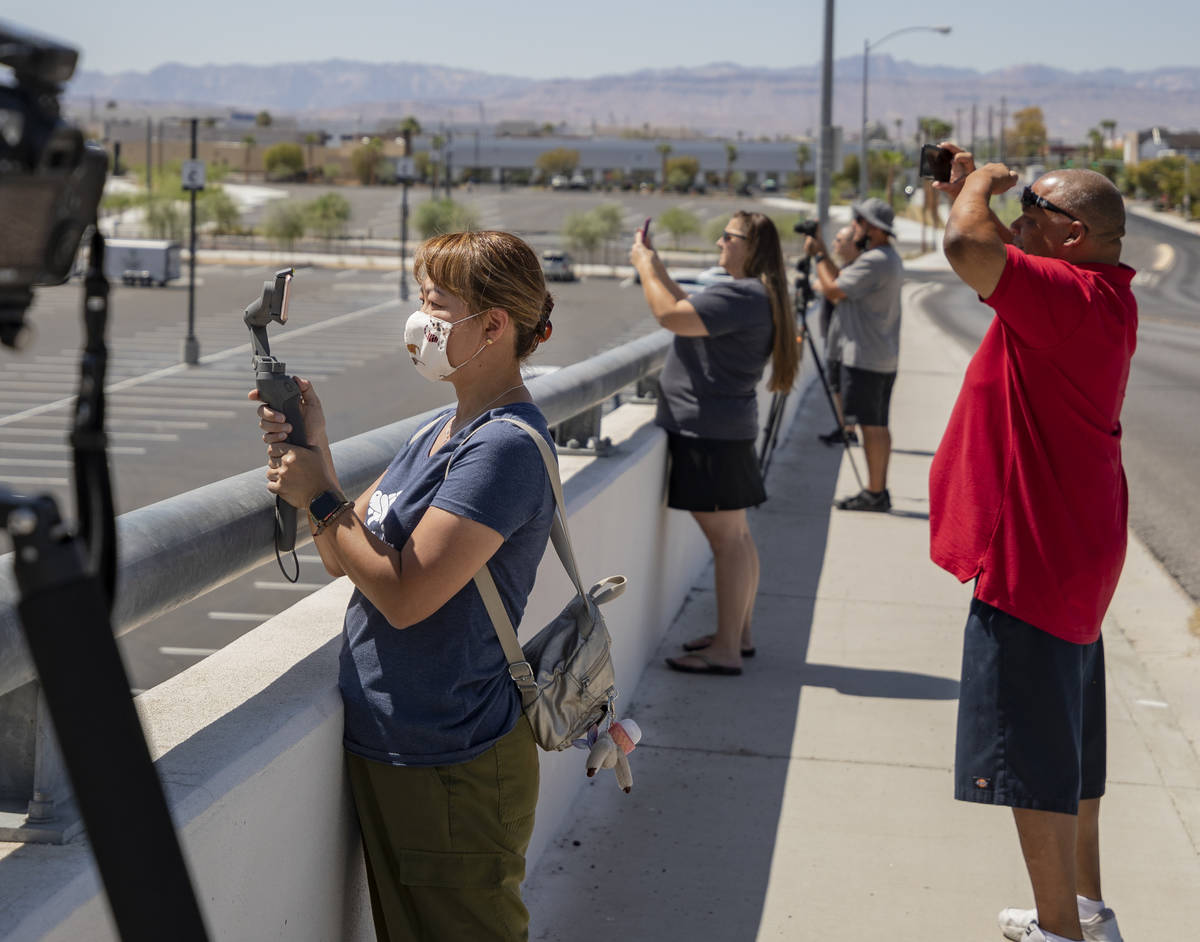 Individuals watch the U.S. Air Force Thunderbirds fly over the Allegiant Stadium on Monday afte ...