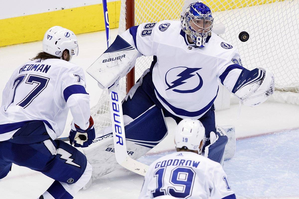 Tampa Bay Lightning goaltender Andrei Vasilevskiy (88) grabs a puck out of the air during the t ...