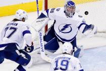 Tampa Bay Lightning goaltender Andrei Vasilevskiy (88) grabs a puck out of the air during the t ...