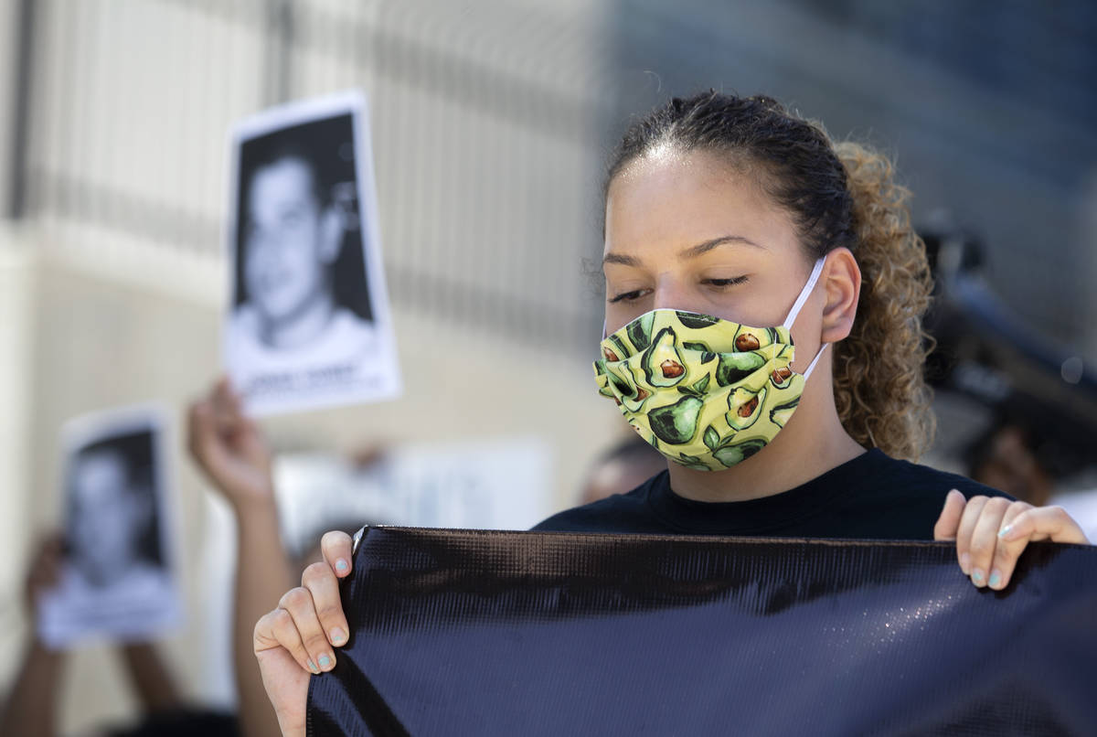 Kimberly Ruiz, Jorge Gomez's cousin, participates in a moment of silence for Gomez during a new ...