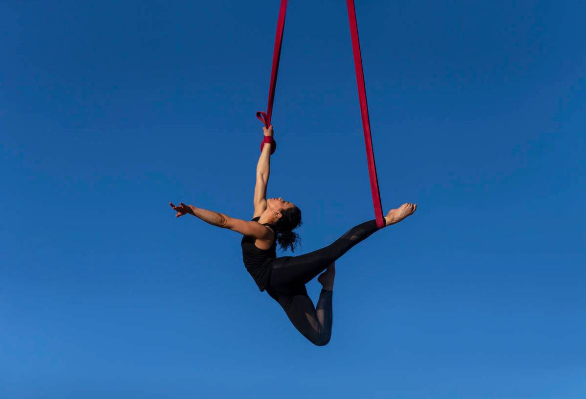 Elema Sanders practices on aerial straps attached to an out-of-service fire truck at the home o ...