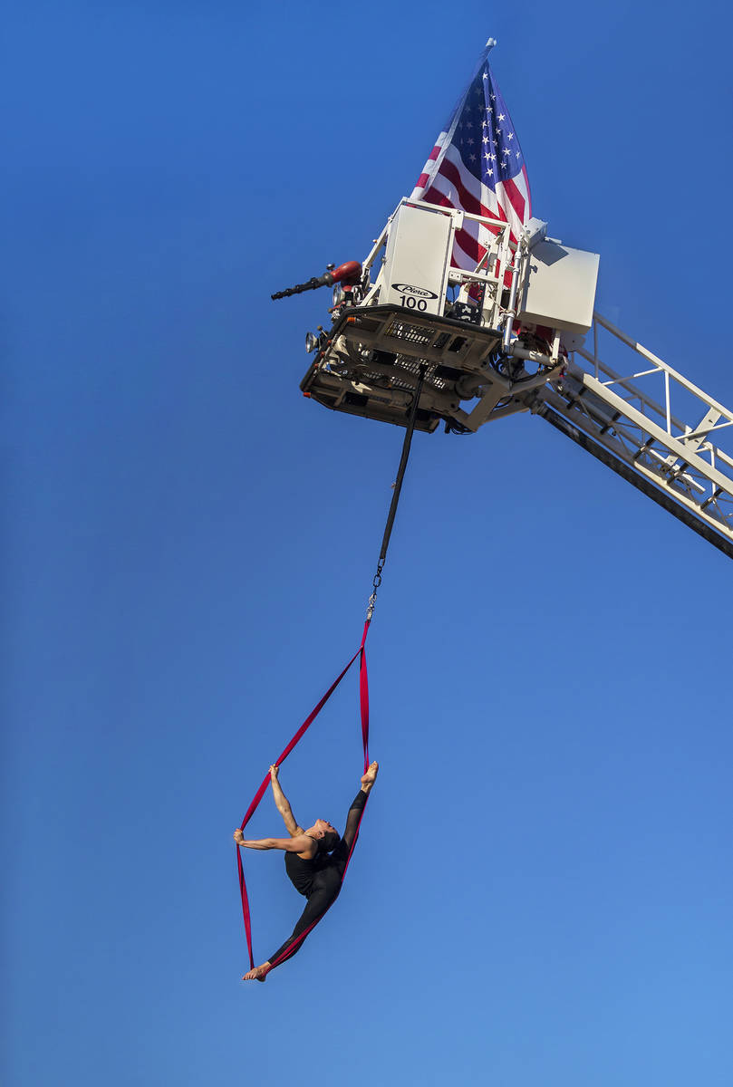 Elema Sanders practices on aerial straps attached to an out-of-service fire truck at the home o ...