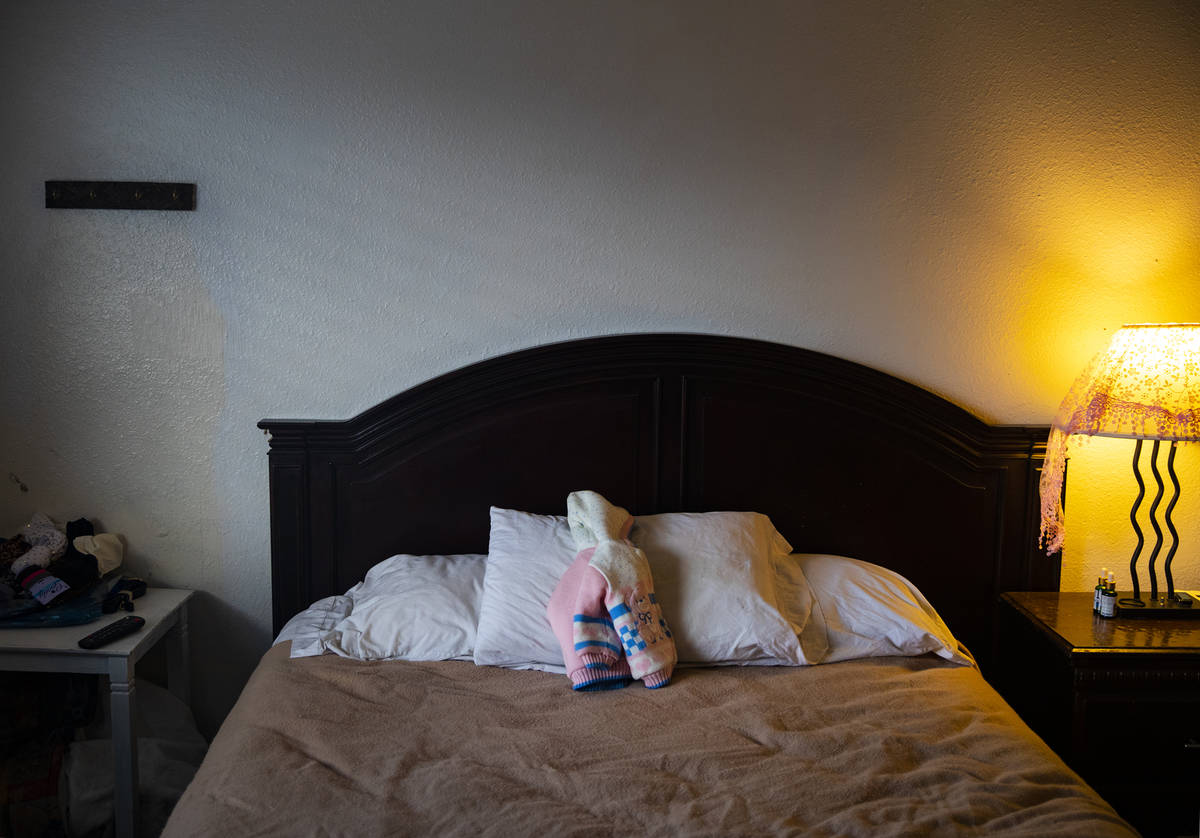 A sweater belonging to Alisha Burns' daughter rests on her bed at her apartment in Boulder City ...