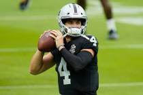 Las Vegas Raiders quarterback Derek Carr (4) trains during an NFL football training camp practi ...