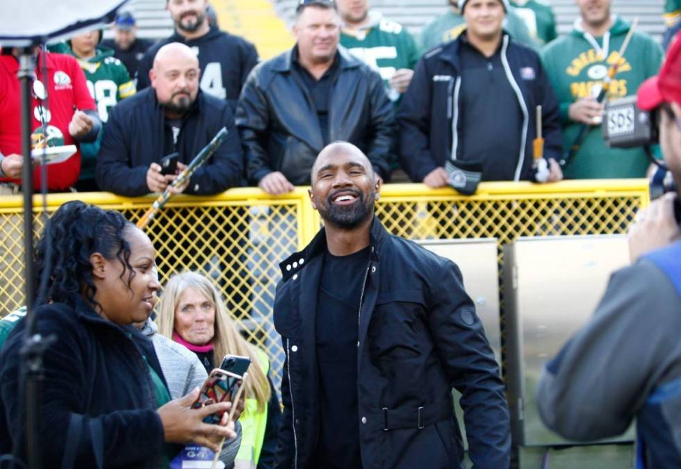 Former Raiders and Green Bay Packers cornerback Charles Woodson meets with fans before an NFL g ...