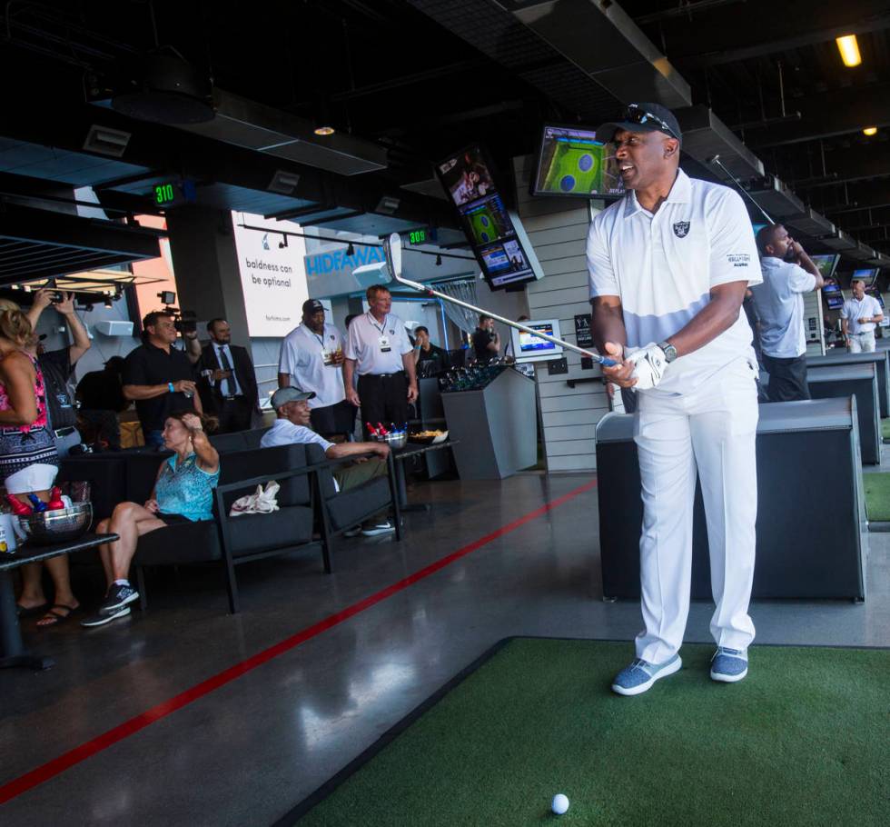 Former Oakland Raiders wide receiver Tim Brown gets ready to swing during the Raiders Foundatio ...