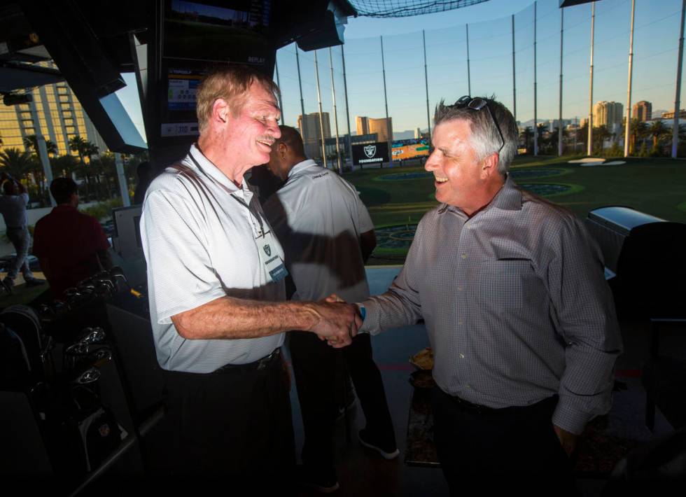 Former Oakland Raiders linebacker Ted Hendricks, left, mingles with attendees during the Raider ...