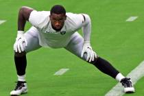 Las Vegas Raiders defensive end Clelin Ferrell stretches on the field prior to a team practice ...