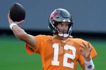 Tampa Bay Buccaneers quarterback Tom Brady (12) throws a pass during an NFL football training c ...