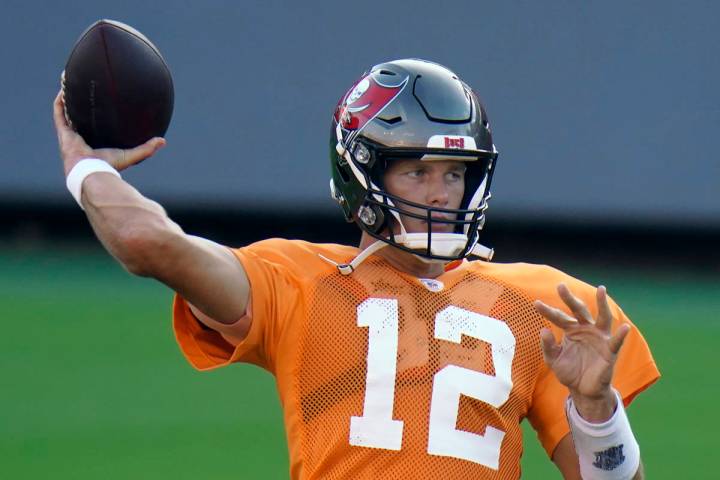 Tampa Bay Buccaneers quarterback Tom Brady (12) throws a pass during an NFL football training c ...