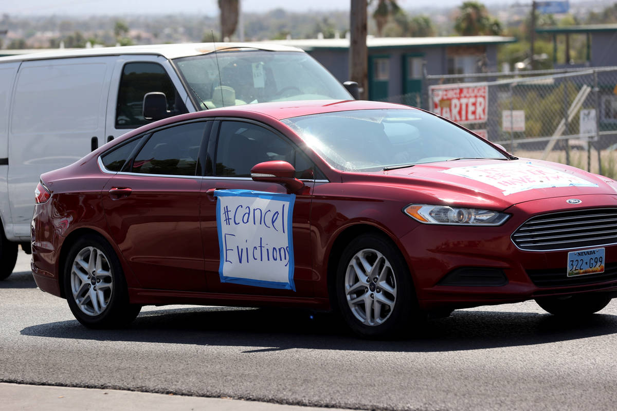 Activists during a car caravan on East Bonanza Road in Las Vegas to protest evictions Tuesday, ...