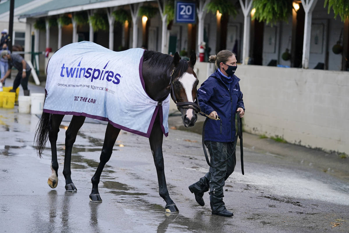 Kentucky Derby entry Tiz the Law is lead back to a stall following a bath at Churchill Downs, T ...