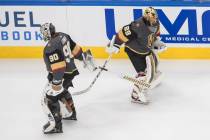 Vegas Golden Knights goalie Robin Lehner (90) and goalie Marc-Andre Fleury (29) tap sticks duri ...